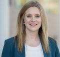 Faculty member with long blonde hair wearing blue blazer